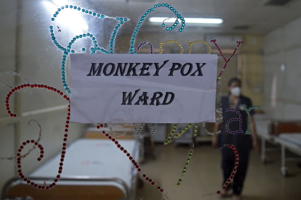 A health worker walks inside an isolation ward built as a precautionary measure for the monkeypox patients at a civil hospital in Ahmedabad  (AFP via Getty Images)