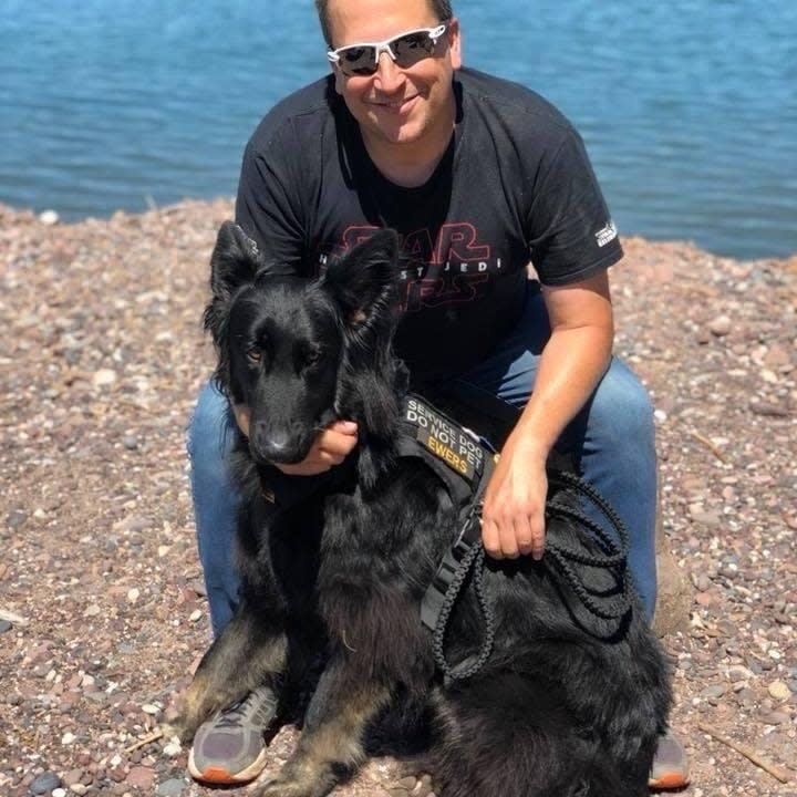 Sheldon Ewers and his retired service dog, Roy, at Lake Superior in June 2018. Roy saved Ewers' life and was awarded the Guardian Angel's Dog Hero of the Year in 2017.