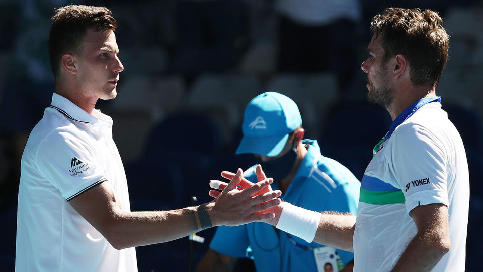 Marton Fucsovics shakes hands with Stan Wawrinka after defeating the former Australian Open champion in the second round. (Photo by Mark Metcalfe/Getty Images)