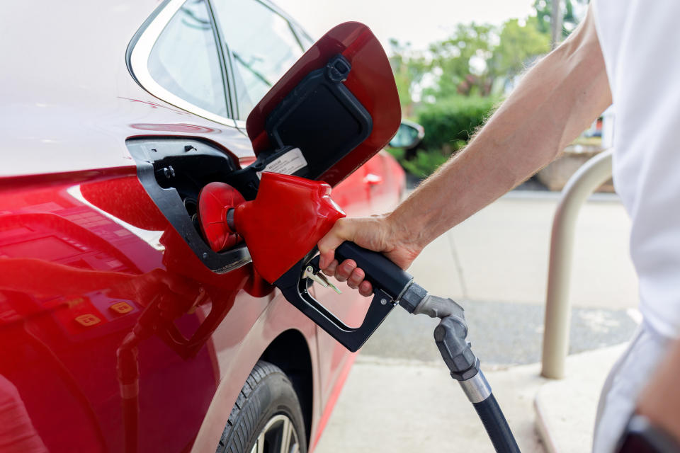 Close-up of unrecognizable man refueling his car at gas station