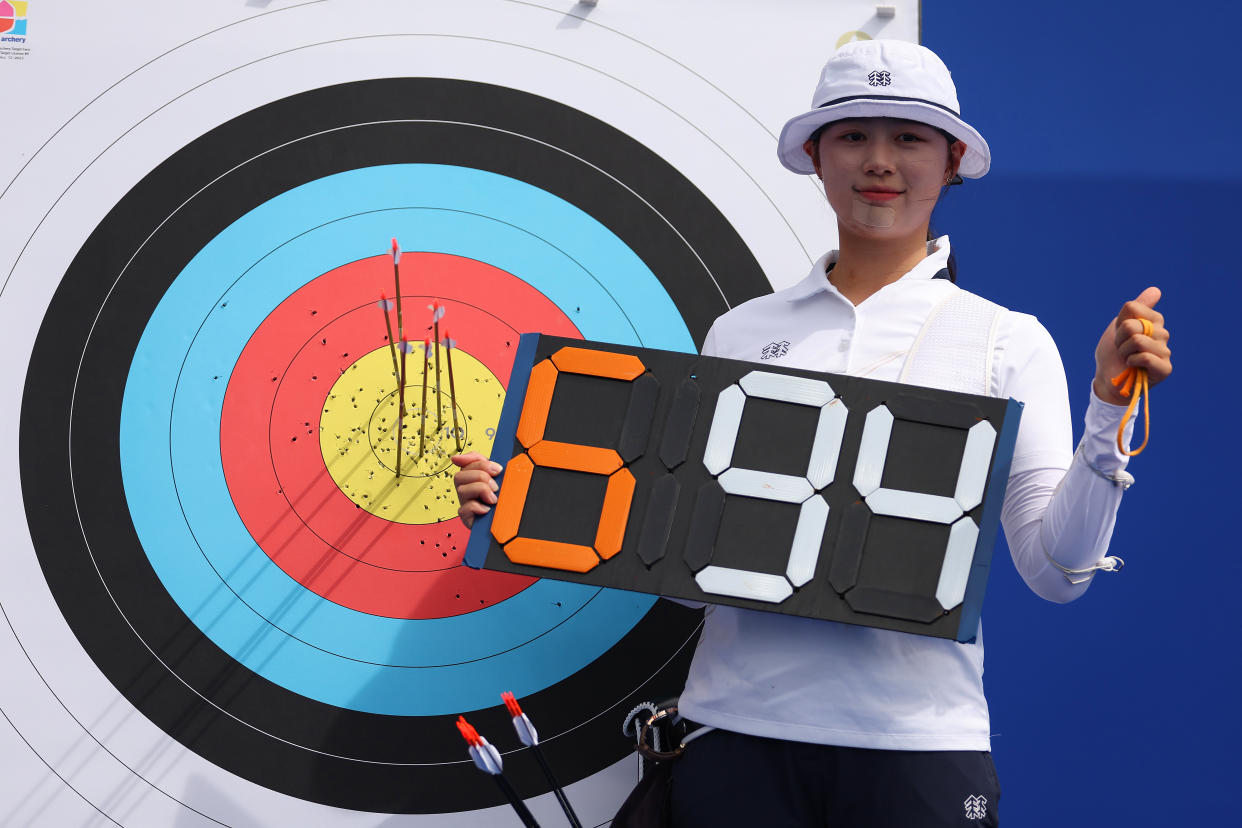 PARIS, FRANCE - JULY 25: Sihyeon Lim of Team Republic of Korea  celebrates after breaking the world record during the Women's Archery Individual Ranking Round on Day -1 of the Olympic Games Paris 2024 at Esplanade Des Invalides on July 25, 2024 in Paris, France. (Photo by Julian Finney/Getty Images)