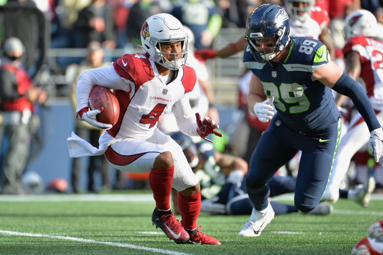 Nov 21, 2021; Seattle, Washington, USA; Arizona Cardinals specialist Rondale Moore (4) returns a kickoff during the first half against the Seattle Seahawks at Lumen Field.