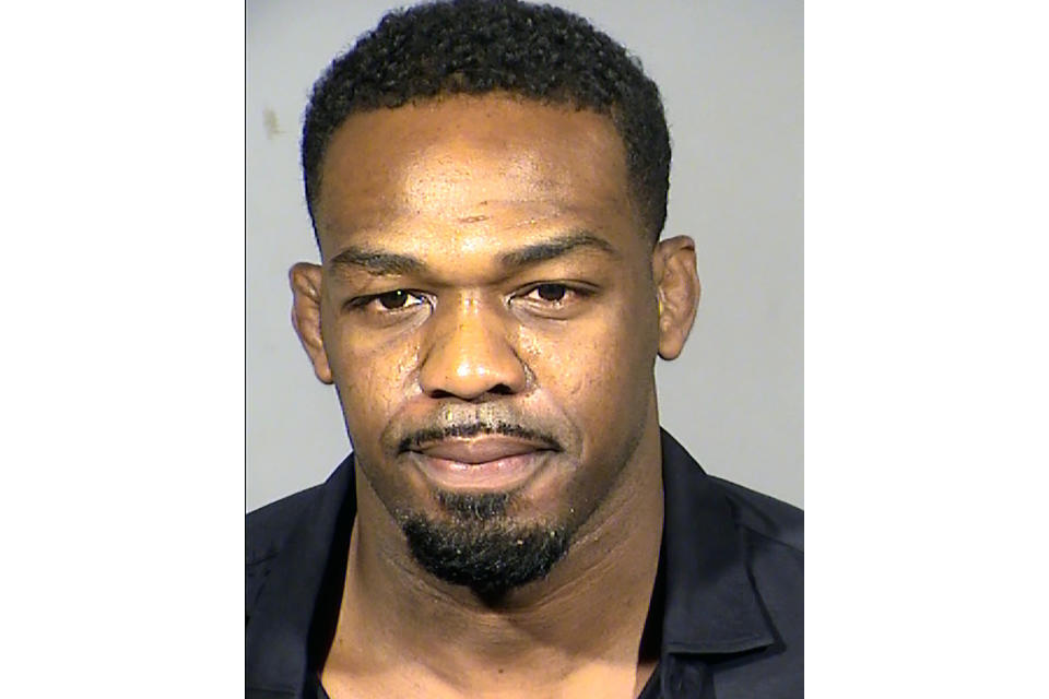 FILE - This booking photo provided by Las Vegas Metropolitan Police Department shows former UFC champion Jon Jones following his arrest on Sept. 24, 2021. A court date was reset Tuesday, Nov. 30, 2021, for former UFC champion Jon Jones to learn whether he'll face misdemeanor and felony charges following his September arrest on allegations that he scuffled with his fiancée and damaged a Las Vegas police vehicle at Caesars Palace. (Clark County Detention Center via AP, File)