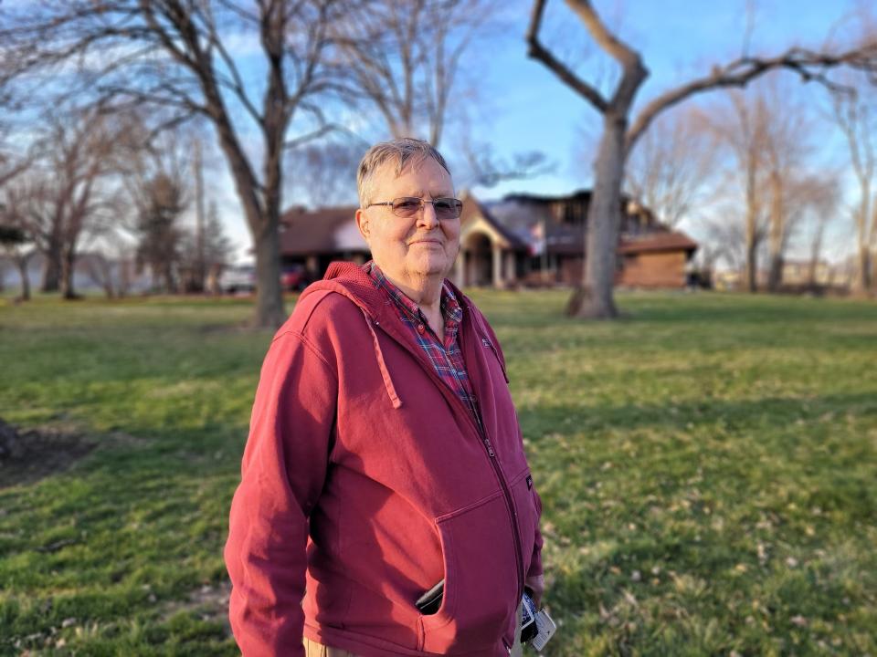 Roger Spahr, 83, stands in the yard of his fire-wrecked home at 9855 N.E. Frisk Drive in Ankeny on Saturday.