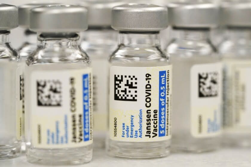 FILE - Vials of the Johnson & Johnson COVID-19 vaccine are seen at a pharmacy in Denver on Saturday, March 6, 2021. On Thursday, May 5, 2022, U.S. regulators strictly limited who can receive this vaccine due to a rare but serious risk of blood clots. (AP Photo/David Zalubowski, File)