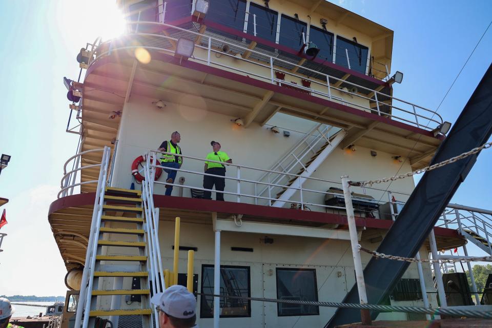The crew aboard the Dredge Potter, a U.S. Army Corps of Engineers vessel, works to maintain a 9-foot-deep channel in the Mississippi River.