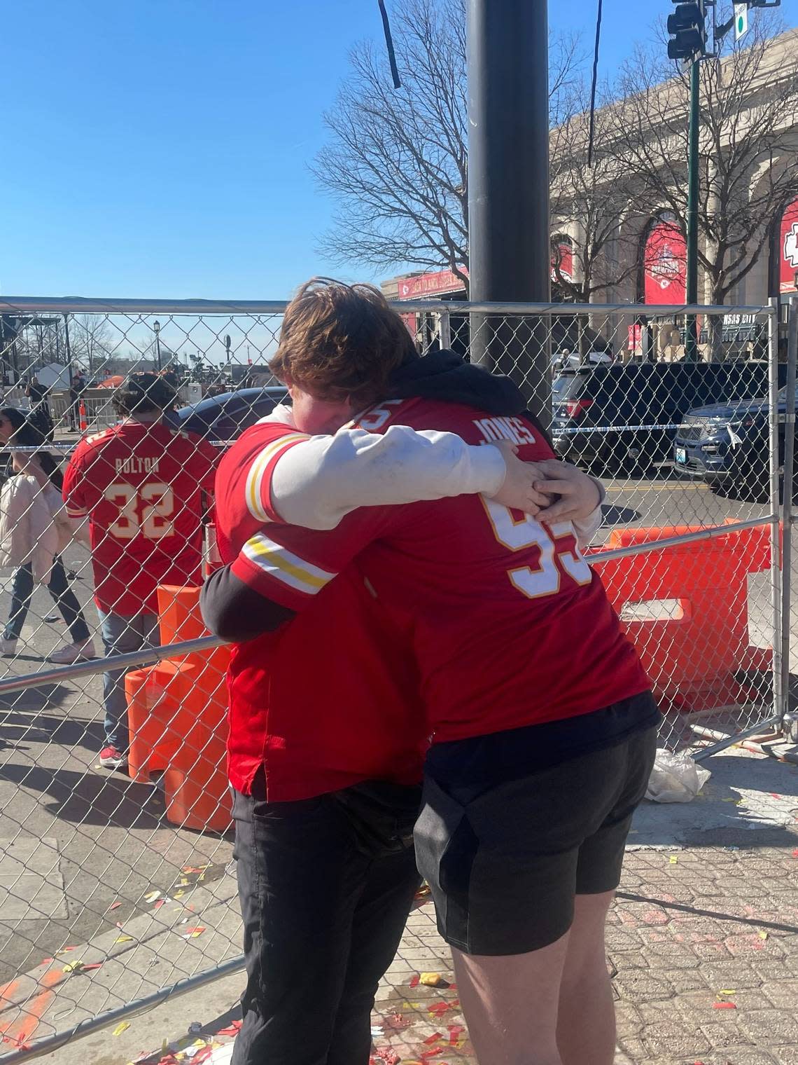 Hank Hunter, left, and Gabe Wallace embraced after reuniting following the shooting at the Kansas City Chiefs Super Bowl parade.