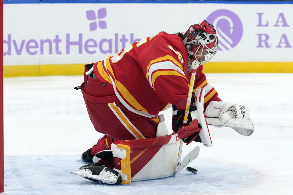 Calgary Flames goaltender Jacob Markstrom (25) makes a save on a shot by the Tampa Bay Lightning during the second period of an NHL hockey game Thursday, Nov. 17, 2022, in Tampa, Fla. (AP Photo/Chris O'Meara)