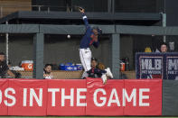 Minnesota Twins center fielder Nick Gordon tries to catch home run hit by Chicago White Sox's Tim Anderson as it goes over the fence during the fourth inning of a baseball game Friday, July 15, 2022, in Minneapolis. (AP Photo/Craig Lassig)