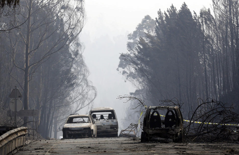 Burned out vehicles on road