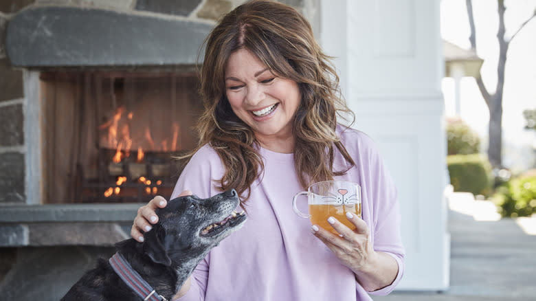 Valerie Bertinelli with her dog holding drink