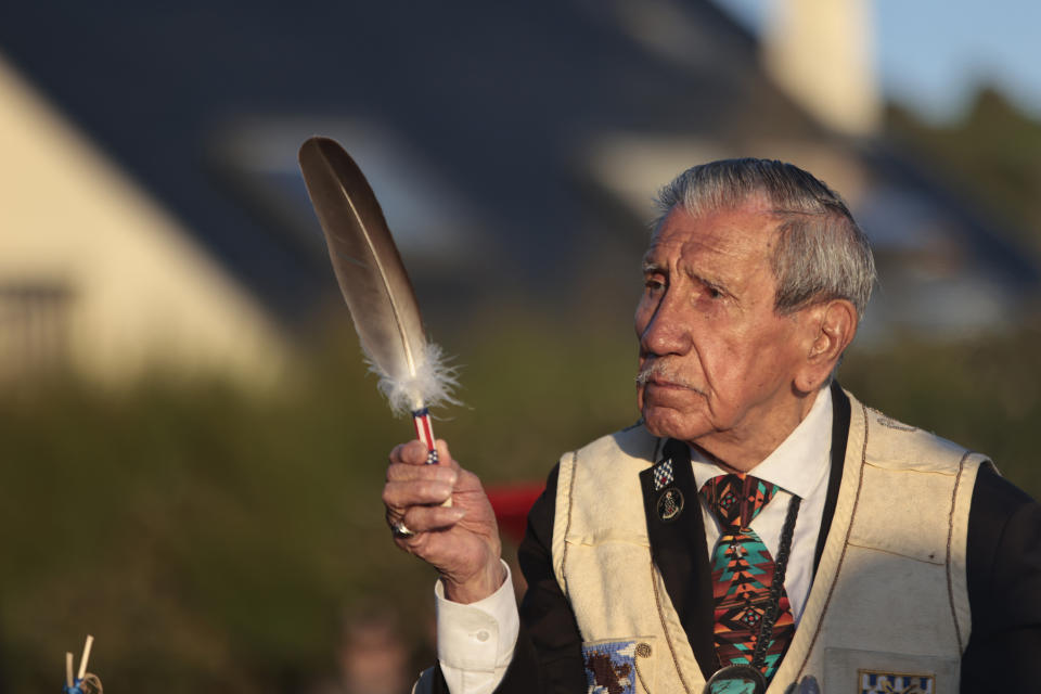 FILE — WWII veteran Charles Shay, pays tribute to soldiers during a D-Day commemoration ceremony of the 78th anniversary for those who helped end World War II, in Saint-Laurent-sur-Mer, Normandy, France, Monday, June 6, 2022. On D-Day, Charles Shay was a 19-year-old Native American army medic who was ready to give his life — and actually saved many. Now 99, he's spreading a message of peace with tireless dedication as he's about to take part in the 80th celebrations of the landings in Normandy that led to the liberation of France and Europe from Nazi Germany occupation. (AP Photo/ Jeremias Gonzalez, File)