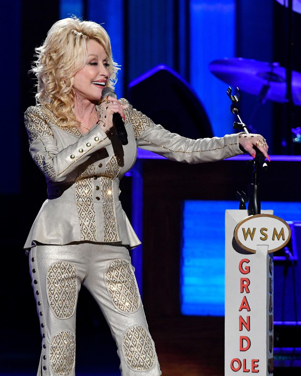 Dolly Parton performs at her 50th Opry Member Anniversary at the Grand Ole Opry House in Nashville in 2019. When she took the stage in 1973, the Opry was housed in the Ryman Auditorium. She says becoming a member is one of proudest early moments.