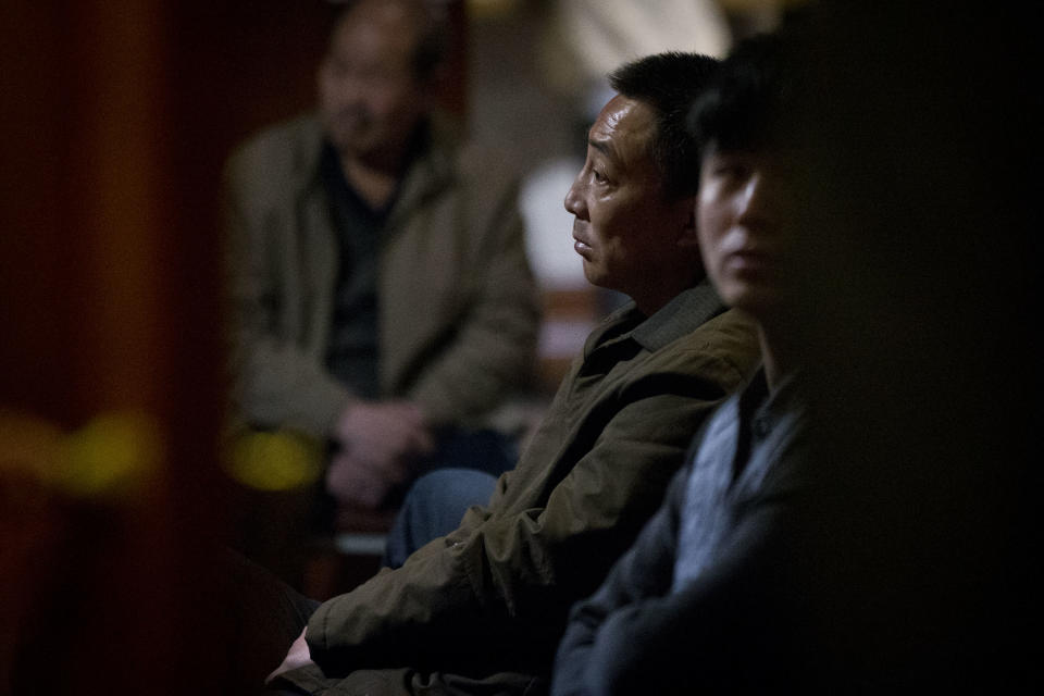 Relatives of Chinese passengers aboard missing Malaysia Airlines flight MH370 watch a TV news program about searching of the missing flight at a hotel ballroom where a daily briefing meeting with managers of Malaysia Airlines is held in Beijing, China, Wednesday, March 19, 2014. Search crews from 26 countries are looking for Malaysia Airlines Flight 370, which vanished early March 8 with 239 people aboard en route from Kuala Lumpur to Beijing. Frustration is growing among relatives of those on the plane at the lack of progress in the search. (AP Photo/Alexander F. Yuan)