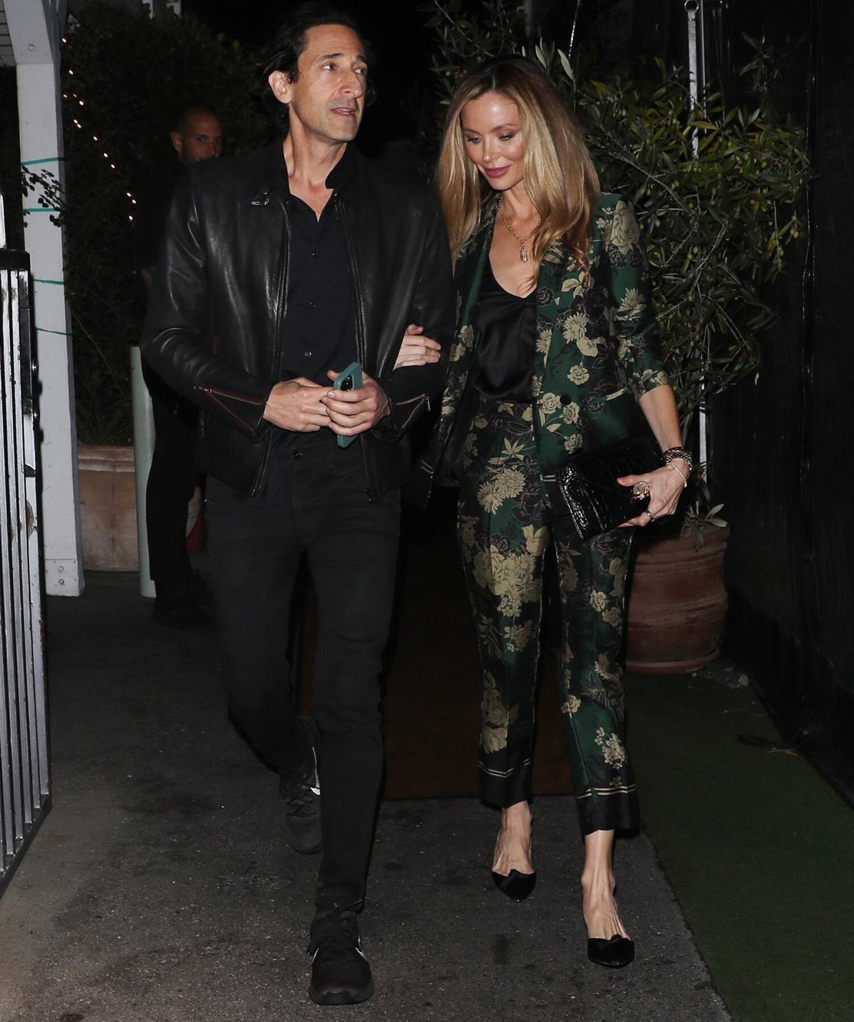 *EXCLUSIVE* - Adrien Brody and Georgina Chapman walk arm in arm as they are spotted exiting Italian restaurant Giorgio Baldi after having a romantic dinner date for two
