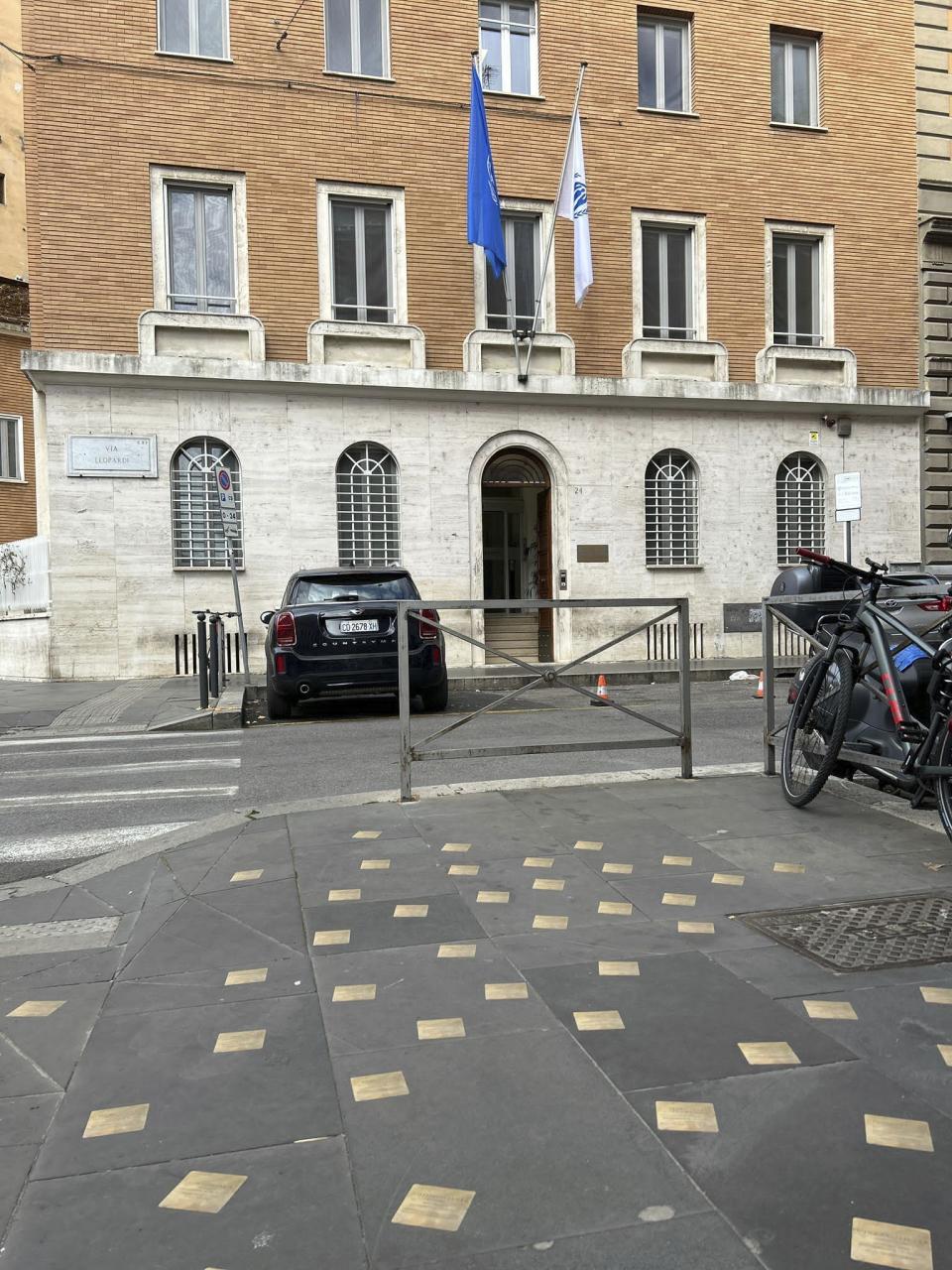 Nearly 50 small bronze plaques appear on the sidewalk in front of the offices of the U.N. refugee agency in Rome with the names of Palestinians killed in Gaza, Friday, Jan. 26, 2024. Italy's president on Friday denounced the rise in antisemitism and delivered a powerful speech in support of the Jewish people as he marked a Holocaust Remembrance Day overshadowed by Israel's military campaign in Gaza and a rise in anti-Israel acts here. (AP Photo/Paolo Santalucia)