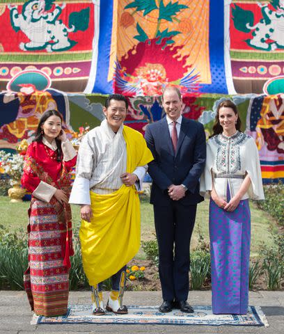<p>Samir Hussein/WireImage</p> From left: Queen Jetsun Pema, King Jigme Khesar Namgyel Wangchuck, Prince William and Kate Middleton at a ceremonial welcome on April 14, 2016 in Bhutan.