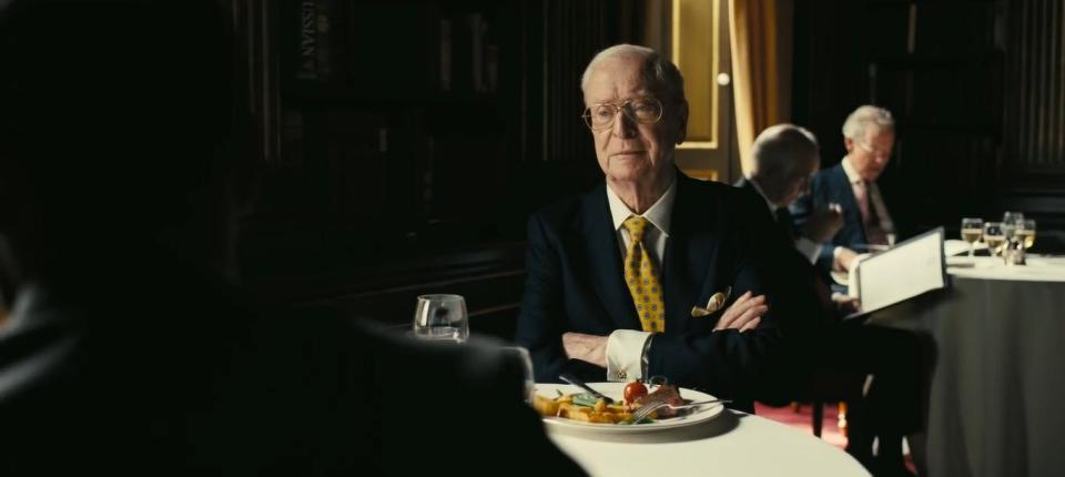 Michael Caine opposite John David Washington on his one day of filming Tenet. (Image by Warner Bros)