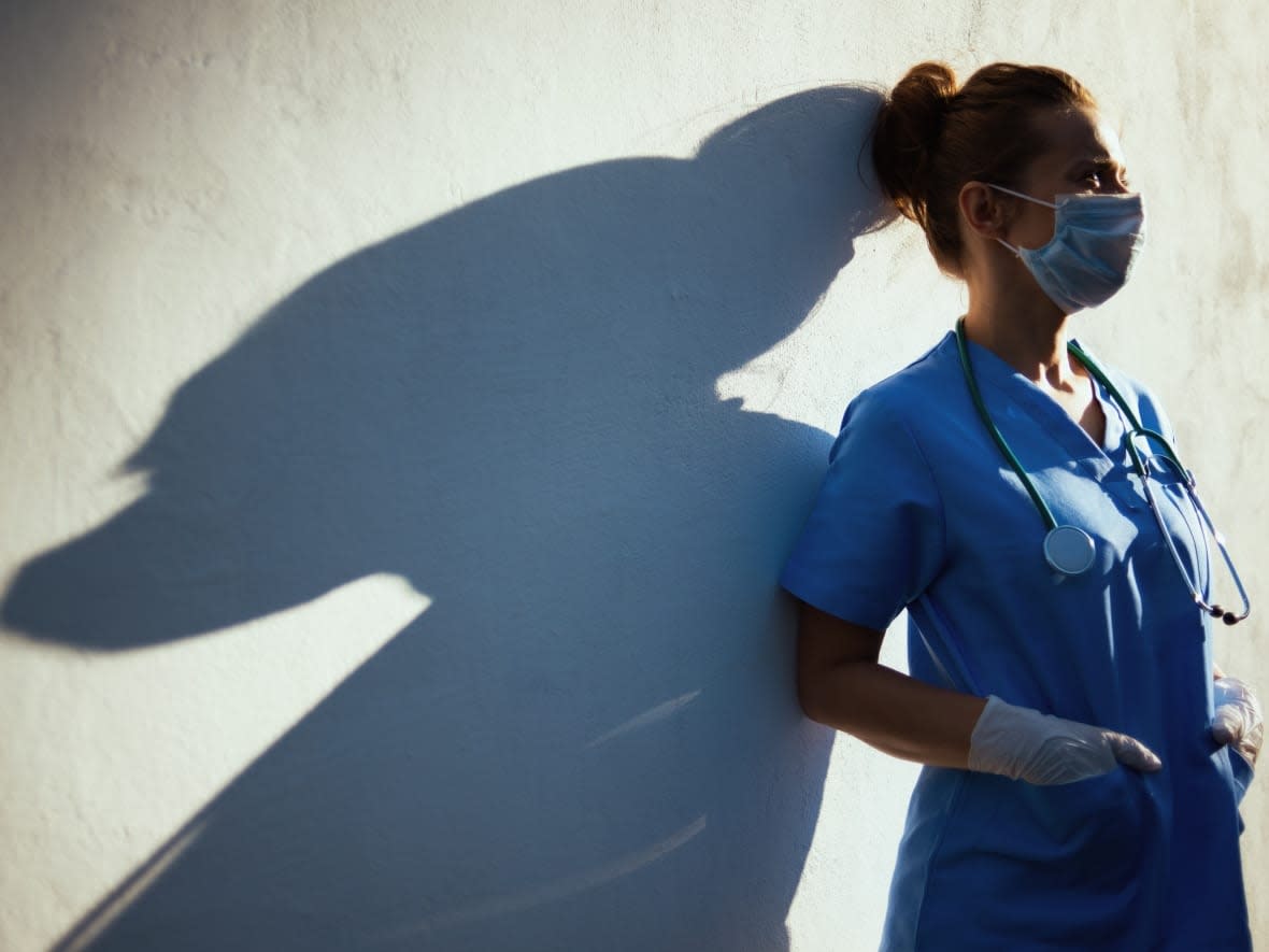 Health-care workers will still be required to wear a mask in acute and long-term care clinical settings, and in public and common areas, according to the memo. (Alliance Images/Shutterstock - image credit)