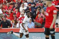 Real Madrid's Aurelien Tchouameni celebrates after scoring the opening goal during a Spanish La Liga soccer match between Mallorca and Real Madrid at the Son Moix stadium in Palma de Mallorca, Spain, Saturday, April 13, 2024. (AP Photo/Francisco Ubilla)