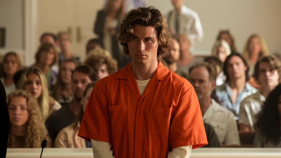 Chase Stokes as John B. in a prison jumpsuit on trial.