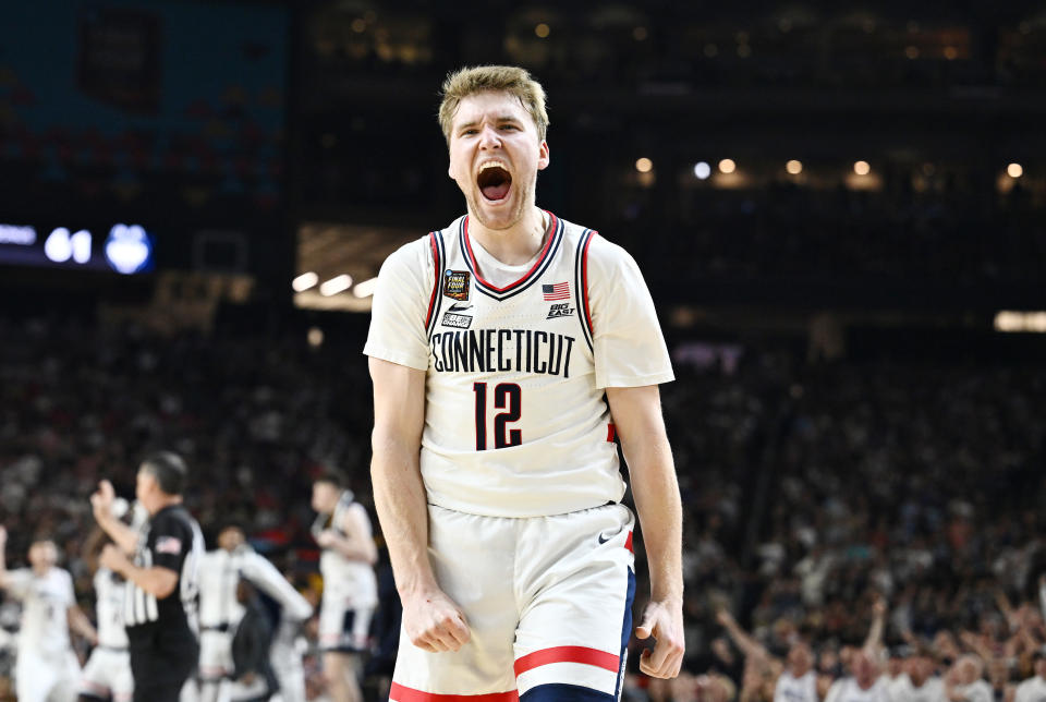 GLENDALE, ARIZONA - APRIL 08: Cam Spencer #12 of the Connecticut Huskies reacts during the second half in the NCAA Men's Basketball Tournament National Championship game at State Farm Stadium on April 08, 2024 in Glendale, Arizona. (Photo by Brett Wilhelm/NCAA Photos via Getty Images)