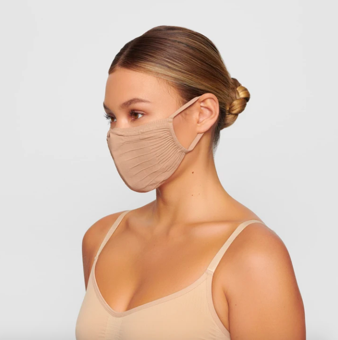 Adult Seamless Knit Face Mask in Clay. Image via skims.com