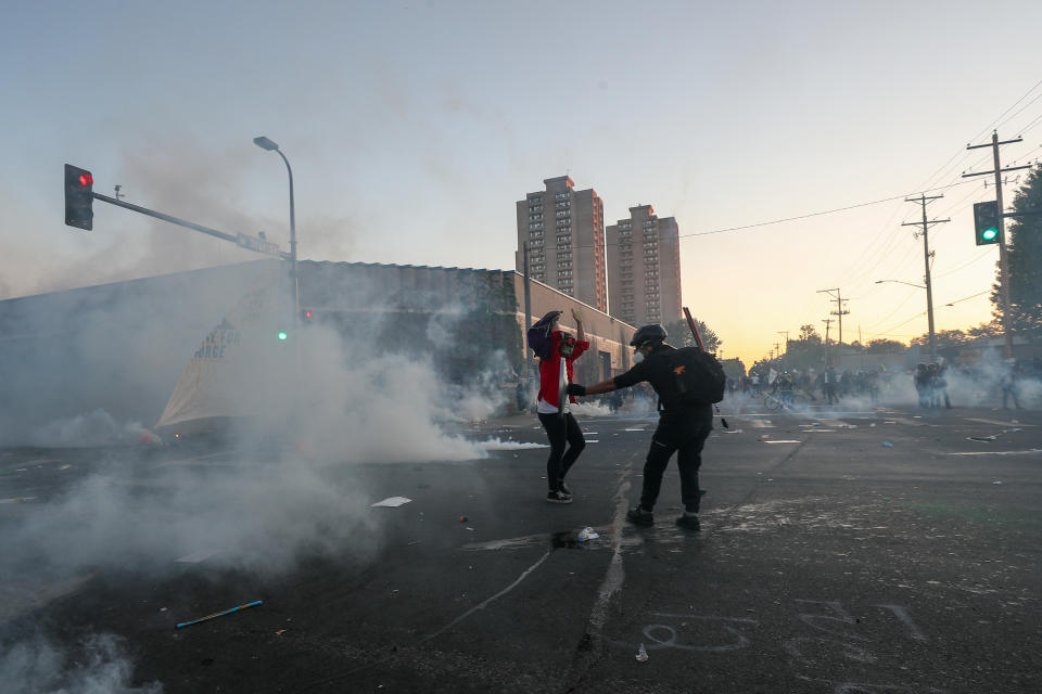 MINNESOTA, USA - MAY 30: Police officers intervene in with tear gas as protesters rally in response to the death of George Floyd, unarmed black man who died after being pinned down by a former white police officer in Minneapolis, MN, United States on May 30, 2020. (Photo by Tayfun Coskun/Anadolu Agency via Getty Images)