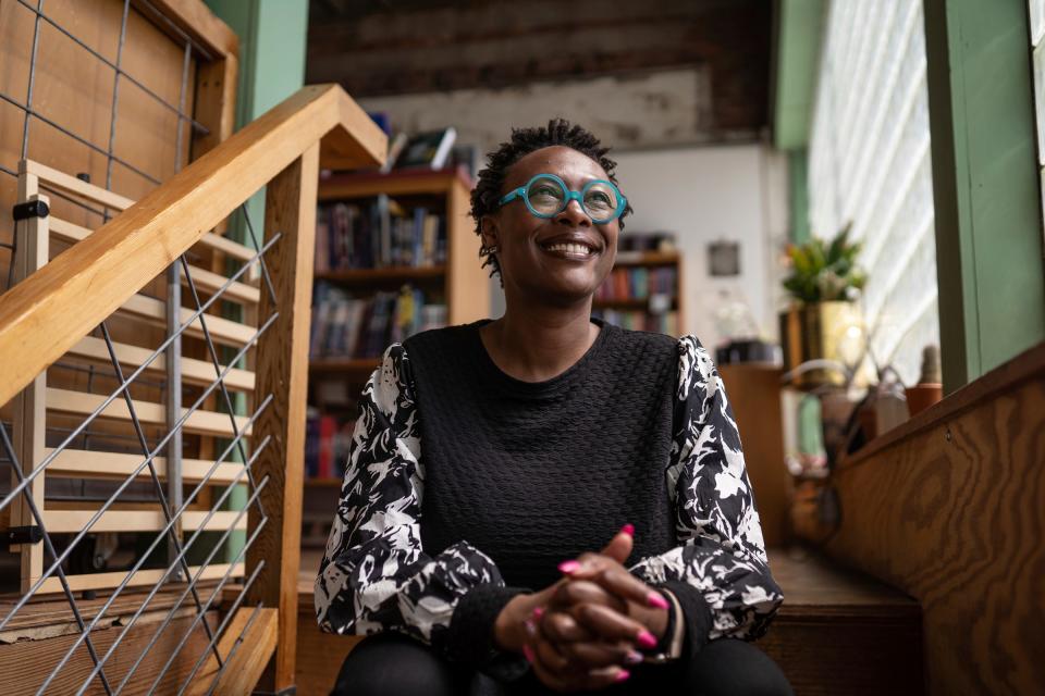 Nandi Comer poses at 27th Letter Books in Detroit on Friday, April 14, 2023. Comer was named Michigan's first poet laureate since the 1950s.