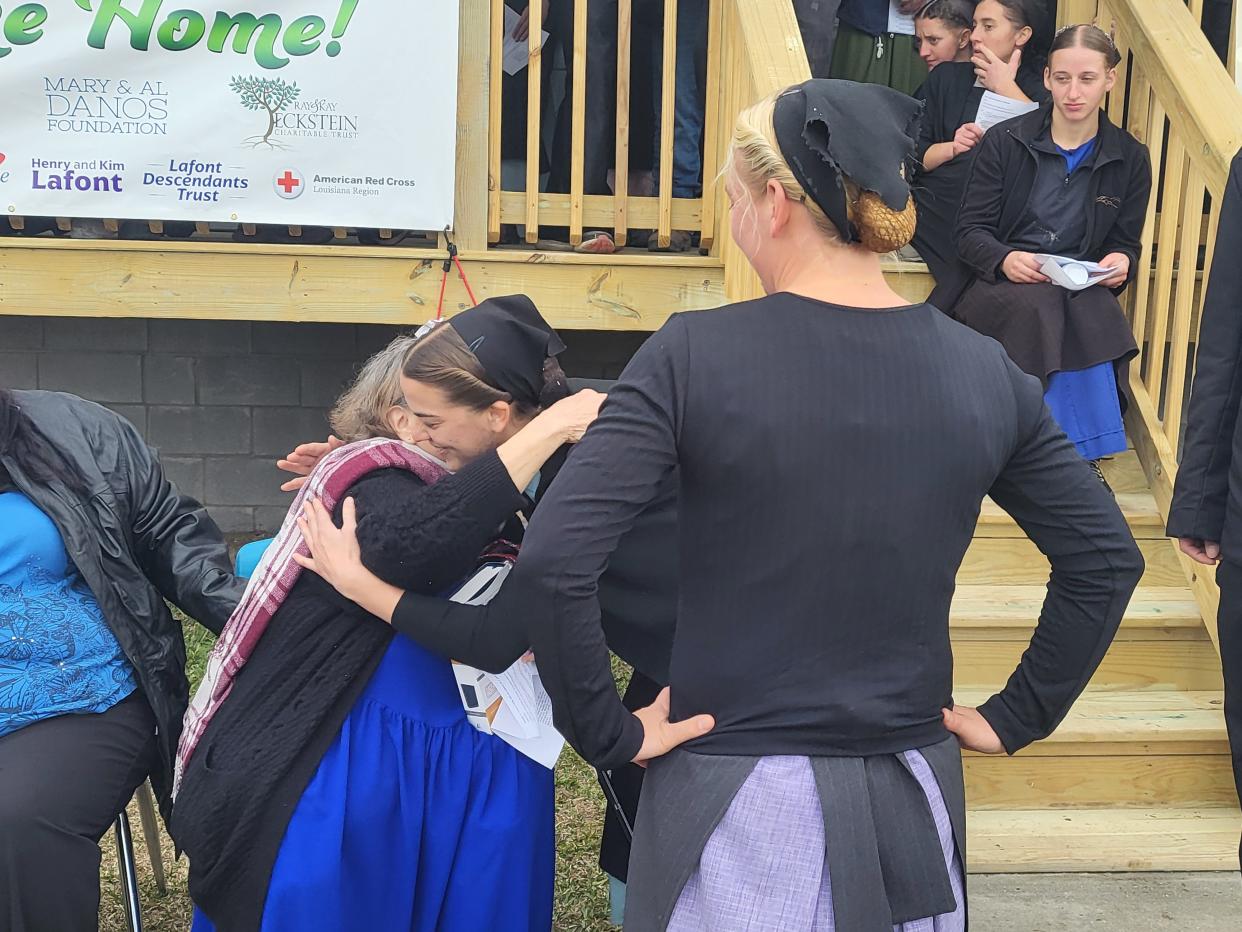Eloise Vizier hugs Katie King during the donation of a new home to Vizier on Jan. 18. Vizier's home was destroyed by Hurricane Ida.