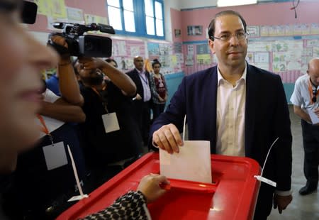 Tunisia's Prime Minister Youssef Chahed, a presidential candidate, casts his vote in a polling station during presidential election in Tunis