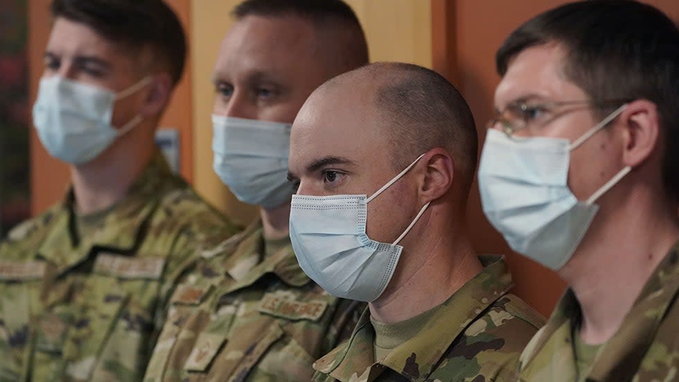 National Guard troops wearing masks