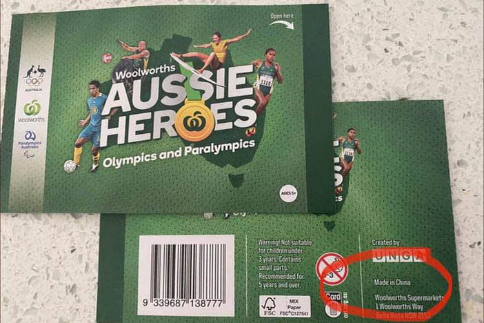 A Woolworths Aussie Heroes sticker package shown with the writing Made in China circled.