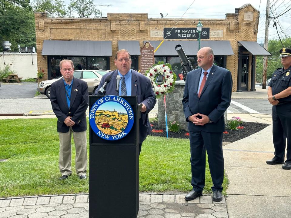 Clarkstown Supervisor George Hoehmann, backed by Rockland County Executive Ed Day, left, and Councilman Michael Graziano, rededicates the renovated monument for World War I veteran Lt. Raymond B. Jauss at Congers Station Park. He received the distinguished service cross posthumously in 1918