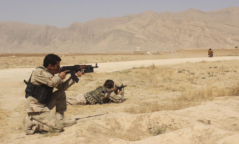 FILE - Afghanistan's security forces take their position during a clash by Taliban fighters in the highway between Balkh province to Kunduz city, north of Kabul, Afghanistan, Sept. 1, 2015. At a time when Americans are deeply divided along party lines, a new poll shows agreement on at least one issue: the United.States' two-decade long war in Afghanistan was not worth fighting. (AP Photo)