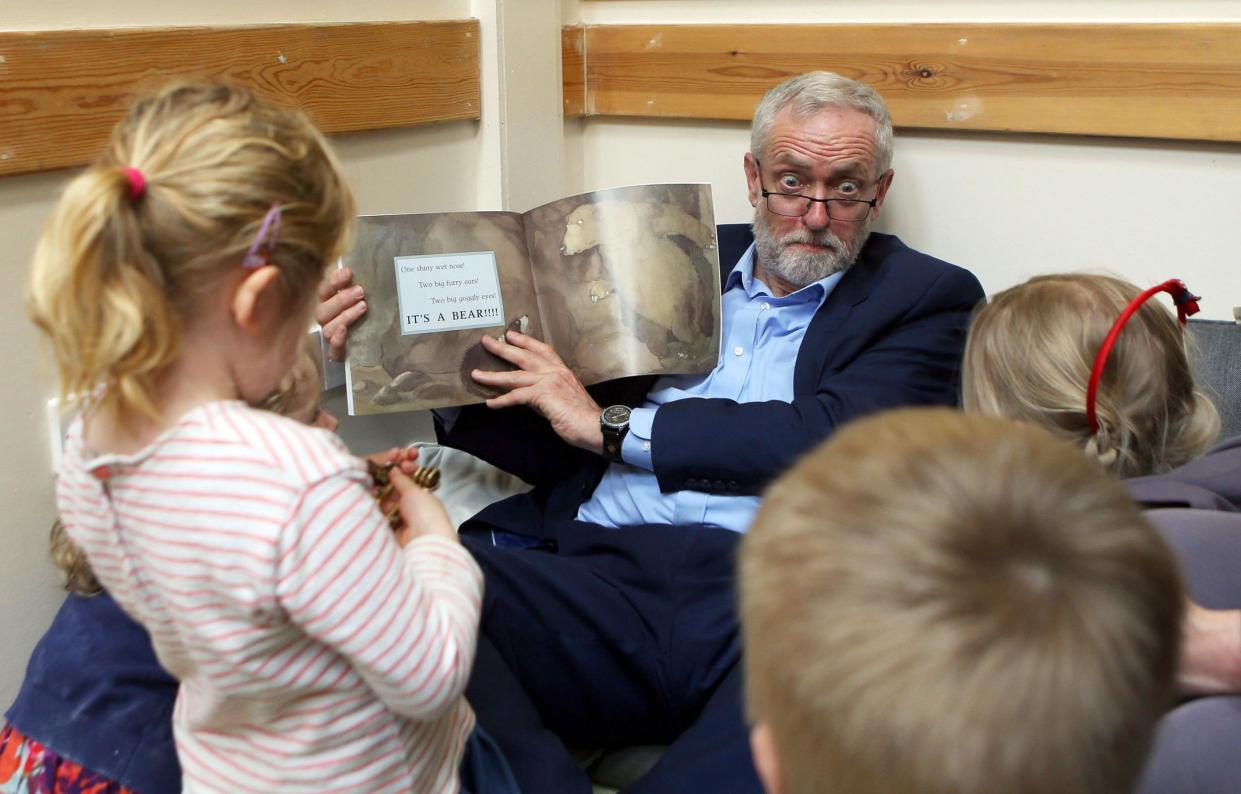 Jeremy Corbyn reads with children as he visits Brentry Children Centre in Bristol: Picture: Steve Parsons/PA Wire/PA Image