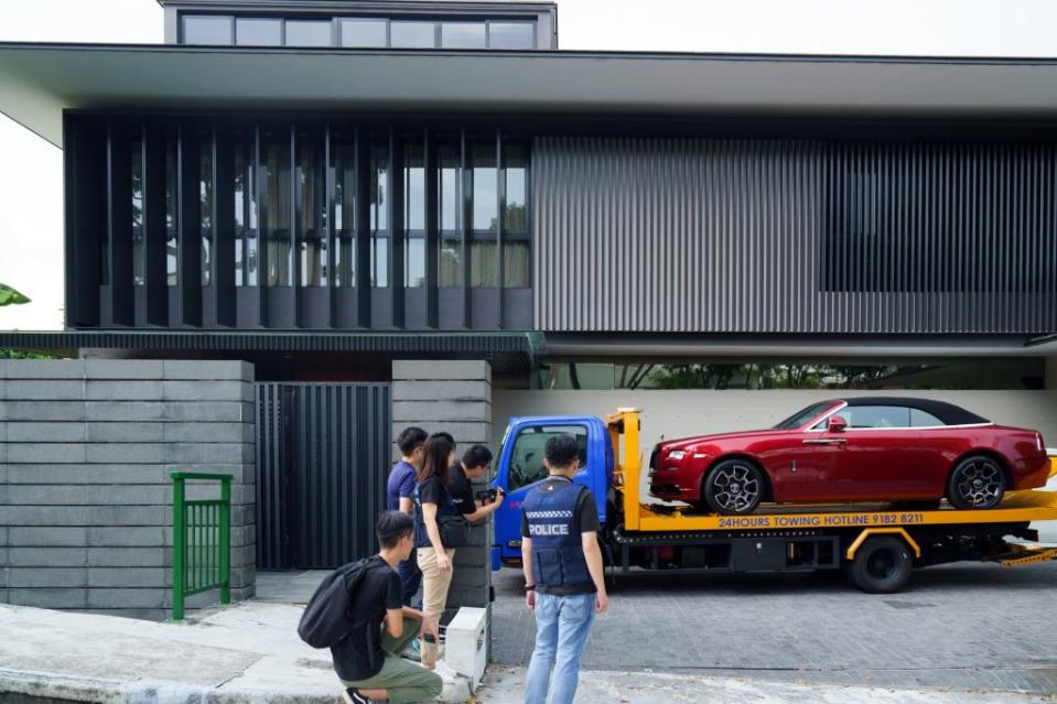 A Rolls-Royce Dawn vehicle seized by police at a residence of Su Jiafeng, one of the suspects in the S$2.8 billion money-laundering case, in Singapore, on Wednesday, Oct. 25, 2023. Allegations have erupted that wealthy Chinese have been pouring ill-gotten gains into the Asian financial hub, in what the government itself describes as potentially one of the world's largest money-laundering cases. Photographer: Ore Huiying/Bloomberg via Getty Images