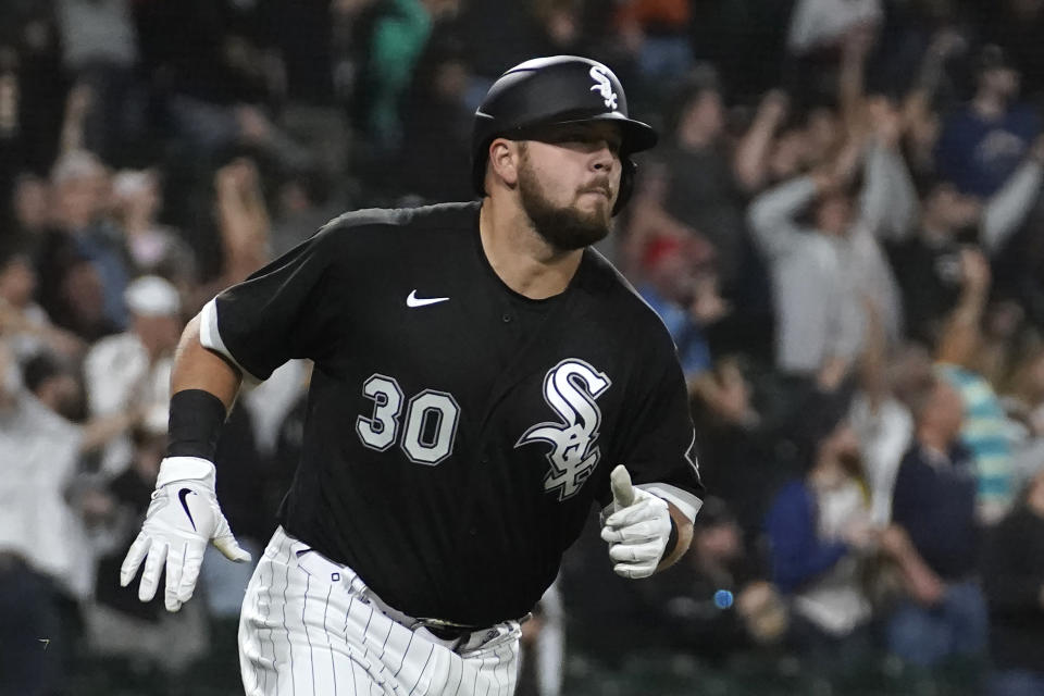 Chicago White Sox's Jake Burger runs the bases after hitting a three-run home run off Boston Red Sox starting pitcher Rich Hill during the fifth inning of a baseball game Wednesday, May 25, 2022, in Chicago. (AP Photo/Charles Rex Arbogast)