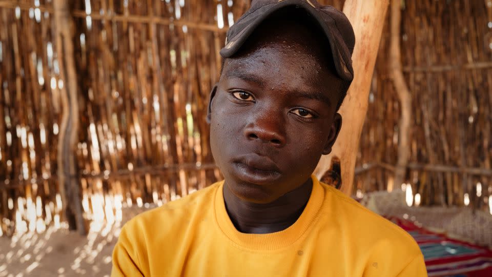 Mahdi, 16, said he was sold as a farmhand after he was kidnapped along with his brother, who was later shot dead. - Alex Platt/CNN