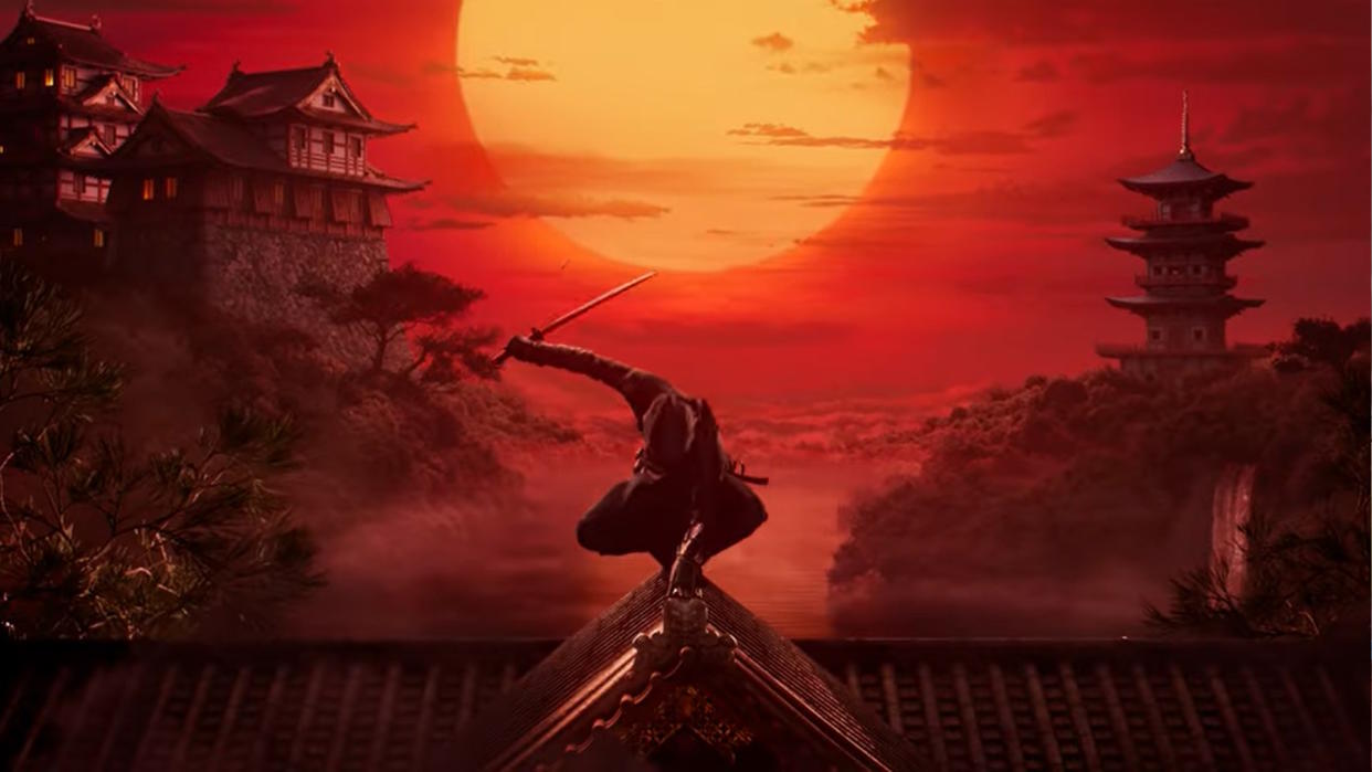  Assassin sits atop a flared roof with a red sunset in the background. 