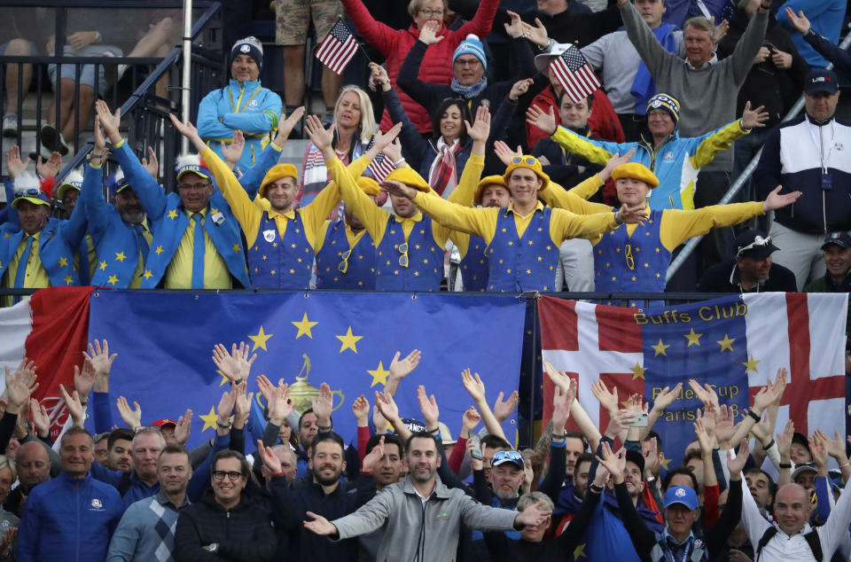 Europe supporters cheer near the 1st tee as they wait for the start of the fourball matches on the opening day of the 42nd Ryder Cup at Le Golf National in Saint-Quentin-en-Yvelines, outside Paris, France, Friday, Sept. 28, 2018. (AP Photo/Matt Dunham)