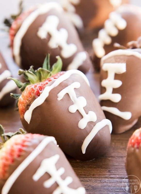 <p>LMLD</p><p><strong>Get the recipe: </strong><a href="https://lmld.org/chocolate-covered-strawberry-footballs/" rel="nofollow noopener" target="_blank" data-ylk="slk:Chocolate-Covered Strawberry Footballs;elm:context_link;itc:0;sec:content-canvas" class="link "><strong>Chocolate-Covered Strawberry Footballs</strong></a></p>