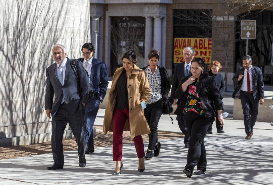 Joe Spencer, far left, lawyer of defendant Patrick Crusius, leads his team upon their arrival to federal court in El Paso, Texas, Wednesday, Feb. 8, 2023. Crusius pleaded guilty to federal charges accusing him of killing nearly two dozen people in a racist attack at an El Paso Walmart in August 2019, changing his plea weeks after the U.S. government said it wouldn't seek the death penalty for the hate crimes and firearms violations. (AP Photo/Andrés Leighton)