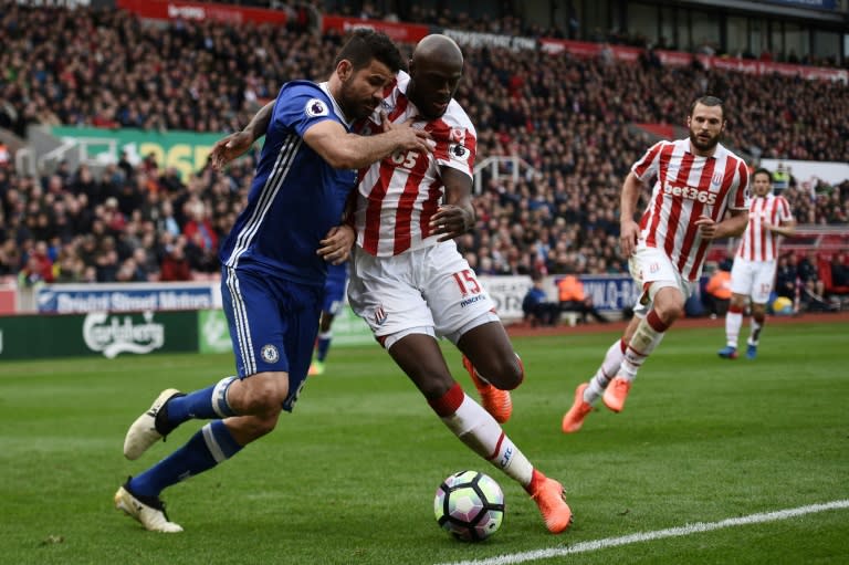 Chelsea's striker Diego Costa (L) vies with Stoke City's defender Bruno Martins Indi during the English Premier League football match March 18, 2017