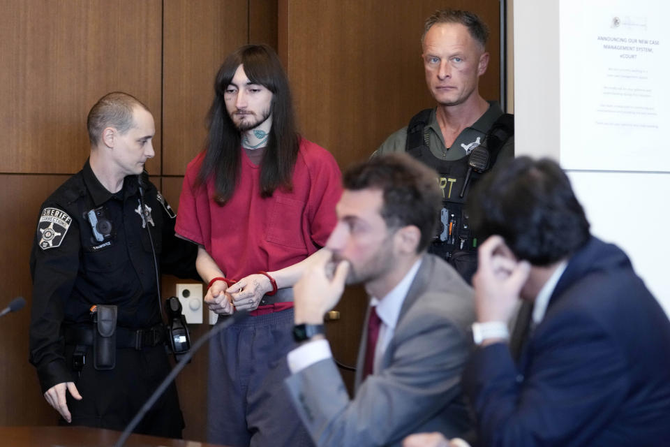 Robert E. Crimo III, is escorted into a courtroom during a case management conference before Judge Victoria A. Rossetti at the Lake County Courthouse Monday, Dec. 11, 2023, in Waukegan, Ill. Robert Crimo III, accused of killing seven and wounding dozens more at a Fourth of July parade in 2022, asked a Lake County judge to allow him to continue without the aid of his assistant public defenders and invoked his right to a speedy trial. (AP Photo/Nam Y. Huh, Pool)