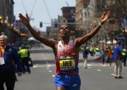 Meb Keflezighi of the U.S. reacts as he wins the men's division at the 118th running of the Boston Marathon in Boston, Massachusetts April 21, 2014. (REUTERS/Brian Snyder)