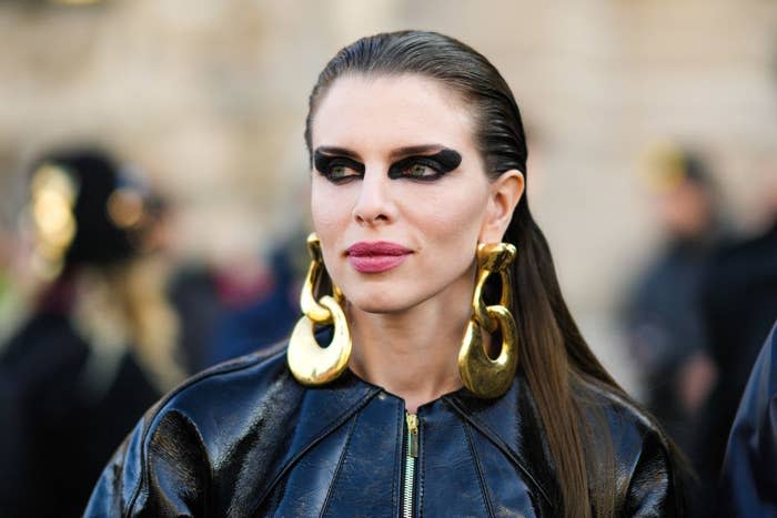 Julia Fox is seen, outside the Schiaparelli show during Paris Fashion Week wearing large dangling earrings
