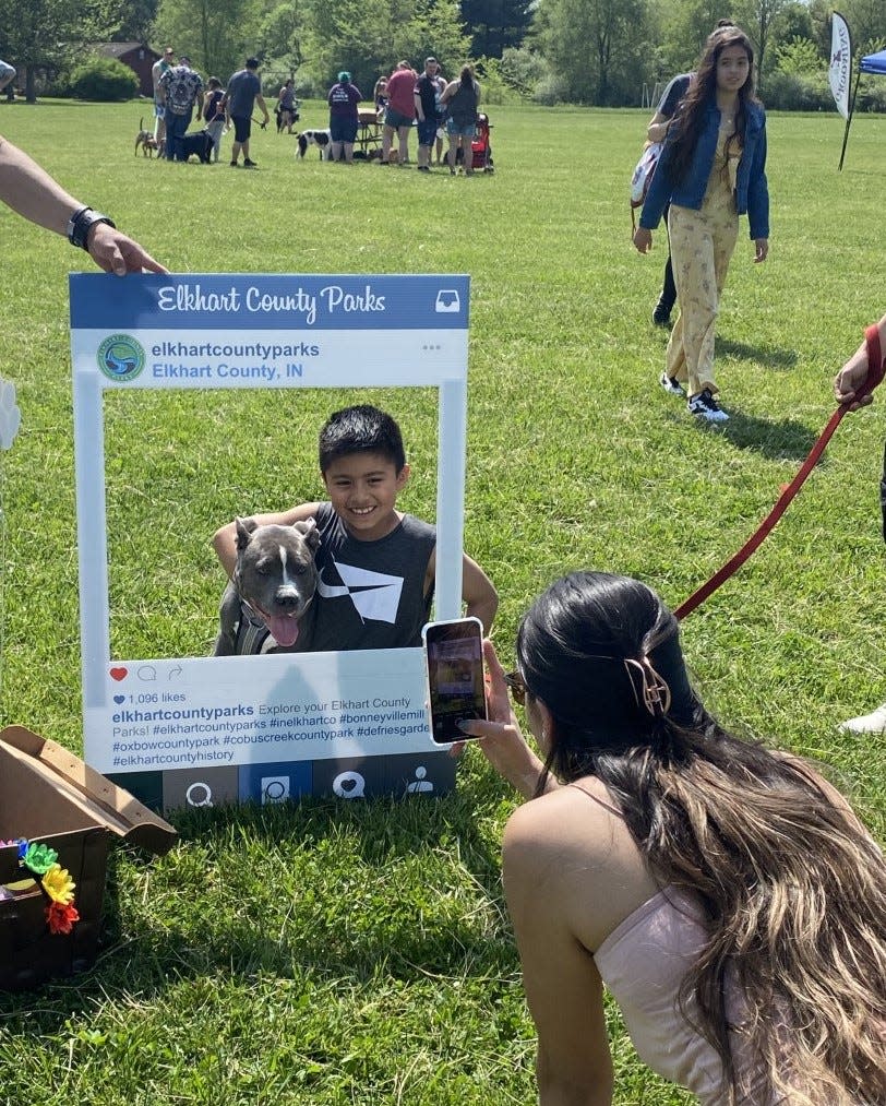 In this provided photo, attendees enjoy a past Elkhart County Parks "Dogapalooza" event. The event takes place again May 13, 2023, at Ox Bow County Park near Goshen.