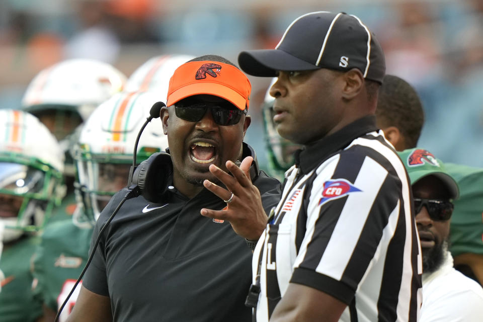 Florida A&M head coach Willie Simmons, left, shouts at an official during the second half of the Orange Blossom Classic NCAA college football game against Jackson State, Sunday, Sept. 3, 2023, in Miami Gardens, Fla. (AP Photo/Lynne Sladky)