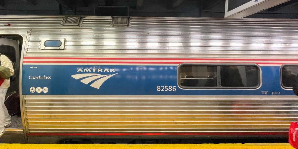 People disembarking the Northeast Regional Amtrak train.